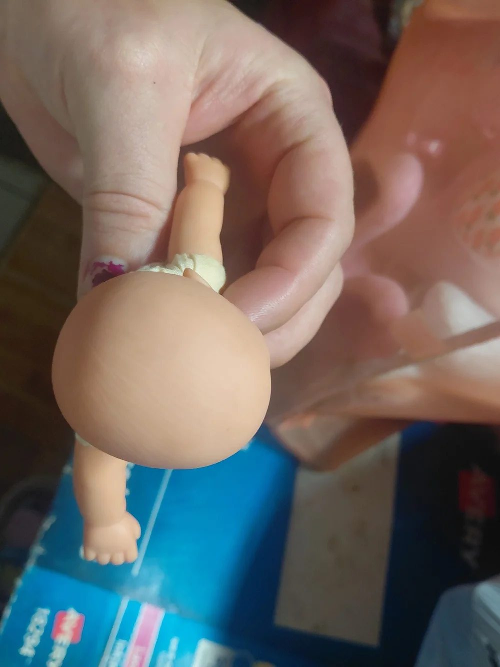 a vintage 1997 Corolle mini baby doll featuring blue eyes and a soft body.